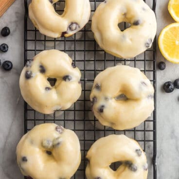 overhead image of 6 baked donuts with glaze