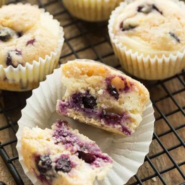 These Blueberry Lemon Muffins with Cream Cheese Swirl are a little sweet, a little tangy and perfect for breakfast or snack! Easy to make ahead and freezer friendly. Includes step by step recipe video. | lemon recipe | lemon bread | berries | yogurt muffins | breakfast | brunch | cream cheese muffins