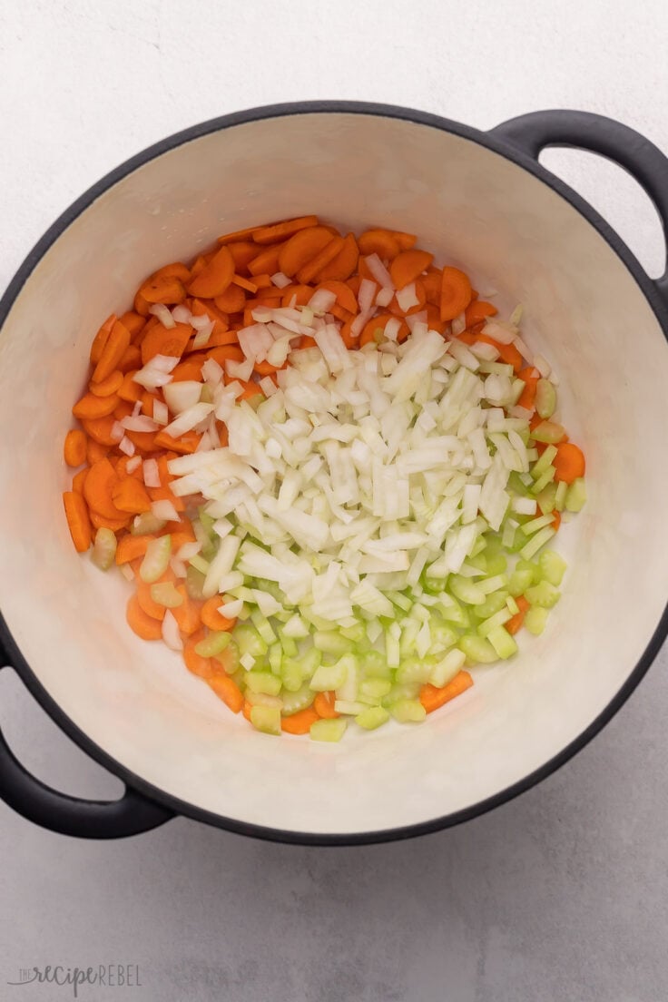 large black pot with chopped vegetables.