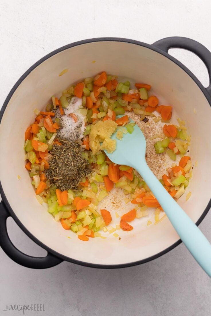 sauteed vegetables and spices in large pot.