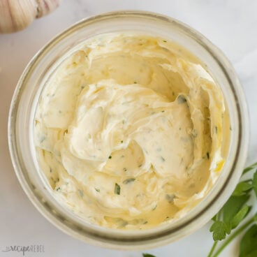 square image of garlic butter in a small jar