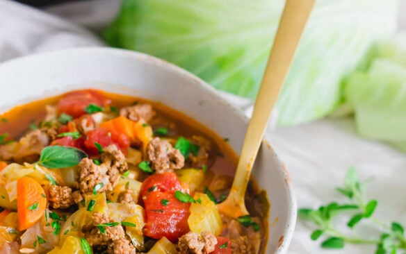 instant pot cabbage soup in bowl with spoon