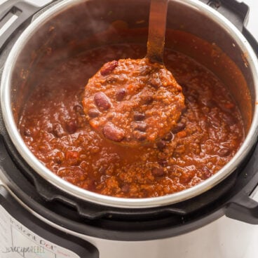 metal ladle scooping instant pot chili out of pot