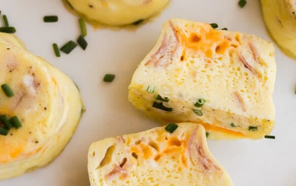 close up of instant pot egg bite cut open on white plate