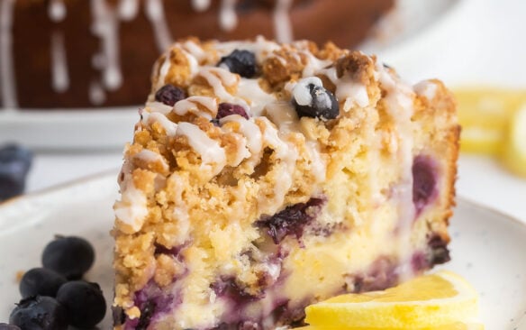 slice of lemon blueberry coffee cake on white plate