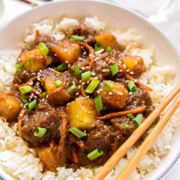 close up image of plate of mongolian beef on rice