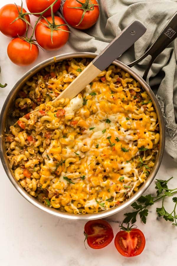 overhead image of taco mac in skillet with wooden spoon