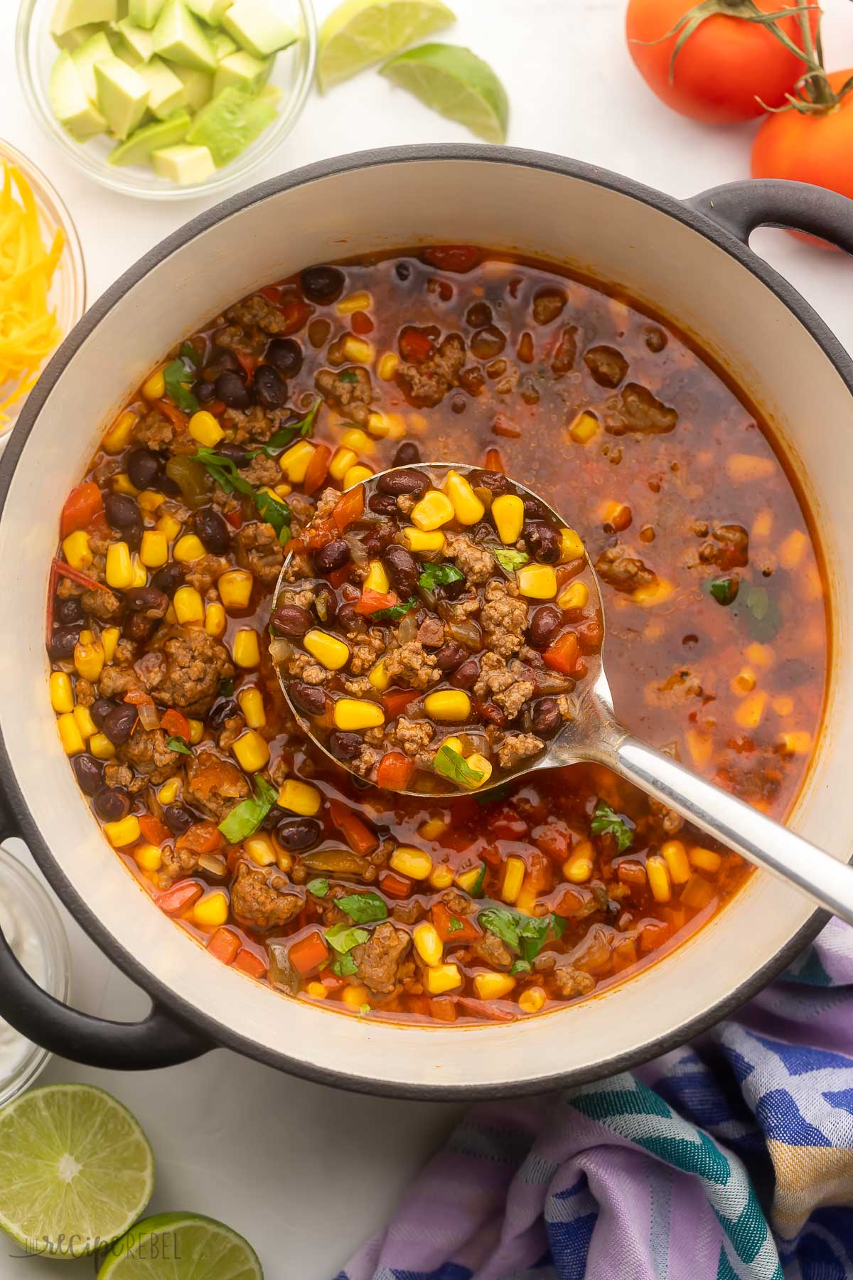 large pot full of taco soup with steel ladle scooping.